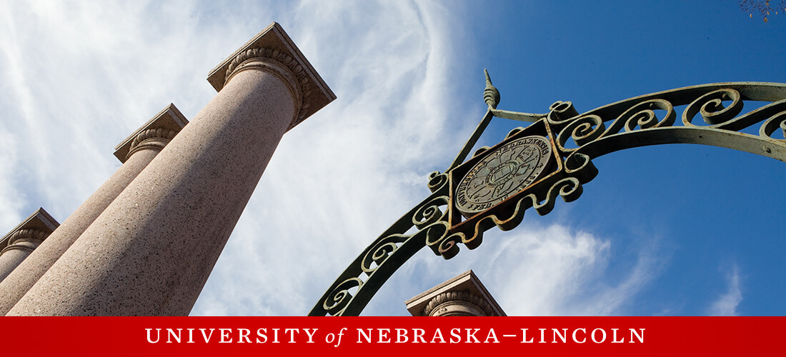 email header featuring a bottom up view of a gate and pillars