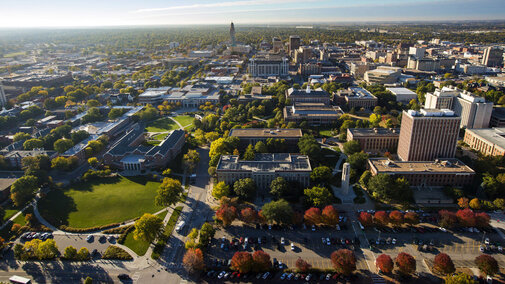 Aerial image of University of Nebraska city campus with state capitol in background