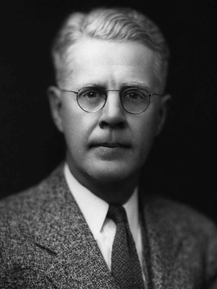 black and grey photo of chancellor boucher