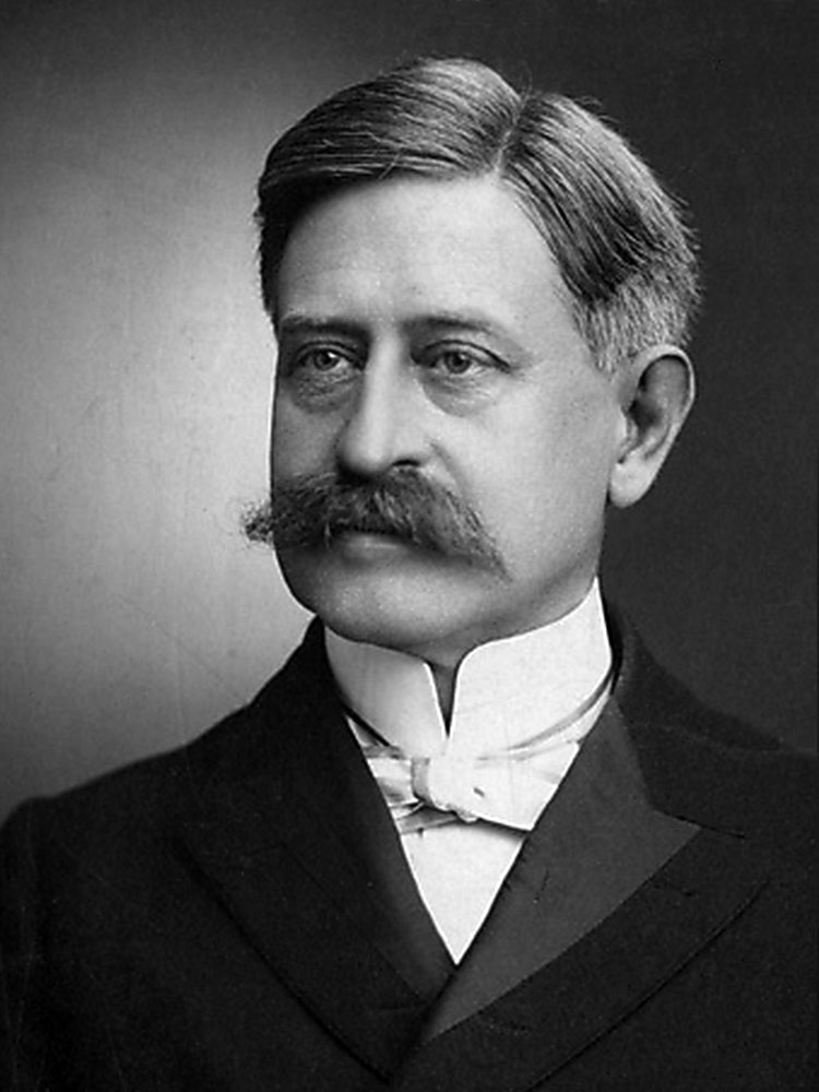 a black and grey photo of chancellor MacLearn